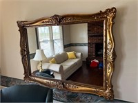 Gold tone plastic framed wall mirror