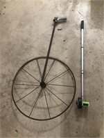 Measuring wheels. One antique wheel doesn’t seem