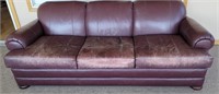 Leather sofa, worn but very comfortable.