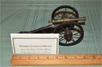 Miniature wood and brass 9" long cannon from the d