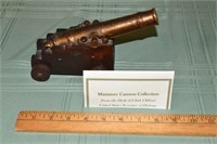 Miniature wood and brass 8" long cannon from the d