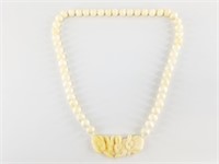 Bone beaded necklace with a lovely bone centerpiec
