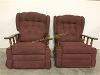 2 maroon reclining rocking chairs