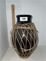 stone vase with straw netting