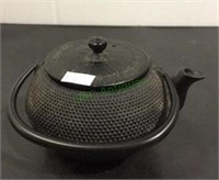 Single cup heavy metal tea pot with strainer.