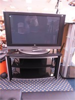 42" LG TV with glass and metal TV stand