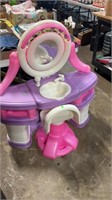 Two piece toy plastic vanity with chair