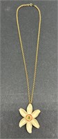 (E) 12k Gold Chain with Flower Pendant. Gold