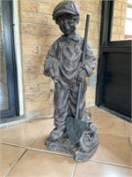 YOUNG BOY WITH SHOVEL