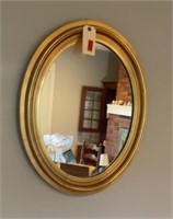 OVAL GOLD ACCENTED MIRROR
