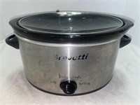 Bravetti 4-quart slow cooker. It’s worn — but it