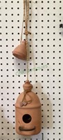 Large terra-cotta birdhouse and very very small
