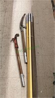 Four long extension poles with a tree saw and