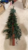Decorative skinny artificial Christmas tree with