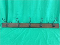 46 inch long antique oak hat rack with man of the