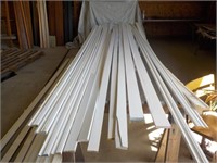 Assortment of primed wood casing and trim boards