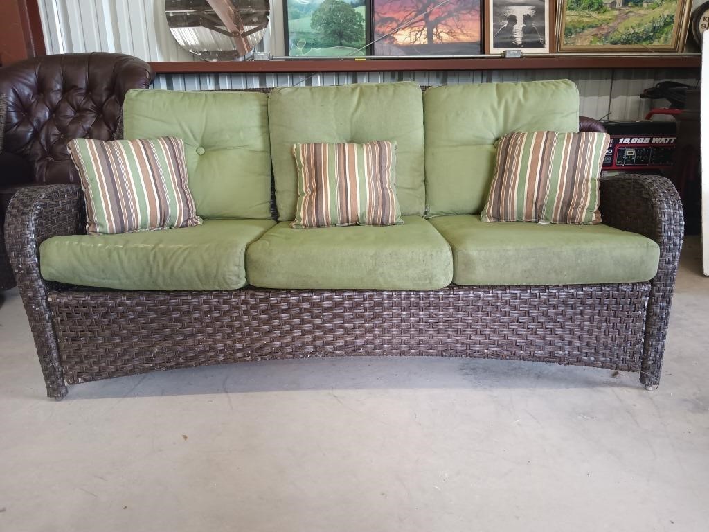 Wicker style patio sofa 76" has some wear