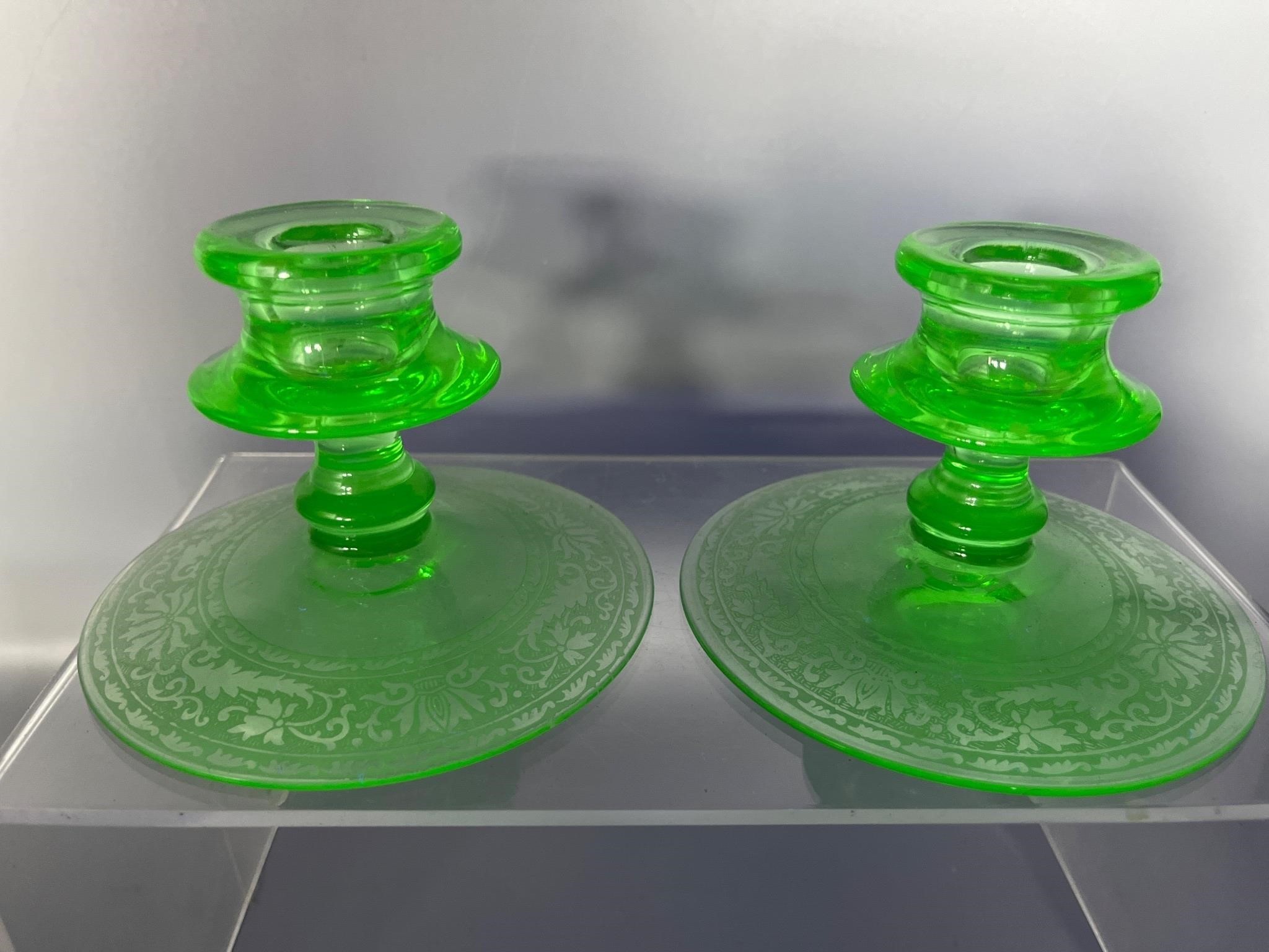 Etched uranium glass candle stick holders