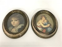 Pair of vintage prints in plastic oval frames