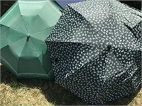 Pair of green patterned umbrellas