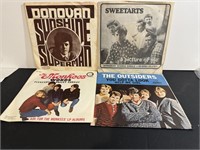 Four vintage 45rpm Records NM