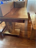 Handmade wood kitchen table with two benches .