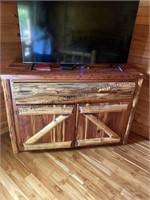 Cabinet with double doors and large drawer. Wood