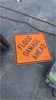FLOOD DAMAGE AHEAD ROAD SIGN