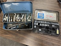 2 metal boxes of sockets and spark plug tools