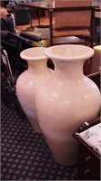 Pair of cream colored ceramic floor urns,