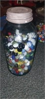 Mason ball jar with marbles and more