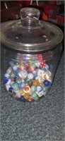 Jar with variety of marbles and more