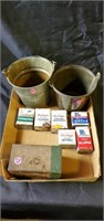 100 cigarettes,  two metal buckets and spice tins
