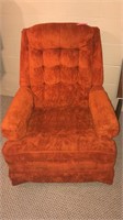 Burnt orange rocking chair