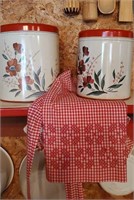 Vintage canisters with apron, set of 2