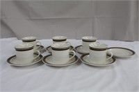 Six stoneware cups and seven saucers