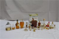 Collection of empty and partial perfume bottles