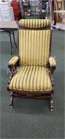 Antique wood frame upholstered rocking chair with