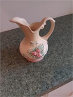 Hold art pottery pitcher vase 5.5 inches tall.