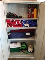 Contents of cabinet. Chairs, life jackets, etc.