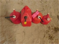4 plastic gas cans w/ air openings 1 - 5 gal