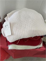 Stack of throws, blankets & more