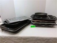 Various kitchen baking sheets and muffin pans