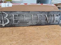 BELIEVE sign , raised letters