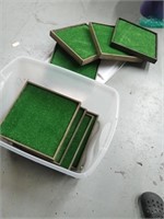 Wood squares with artificial turf.  Squares are