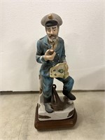 Porcelain sailor on wooden music box stand
