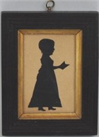 Framed Silhouette Of Young Girl With Book