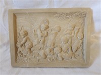 Pottery cherub plaque