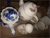 Teapots, cups, and angel decor