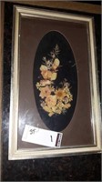 Dried flower arrangement in frame
